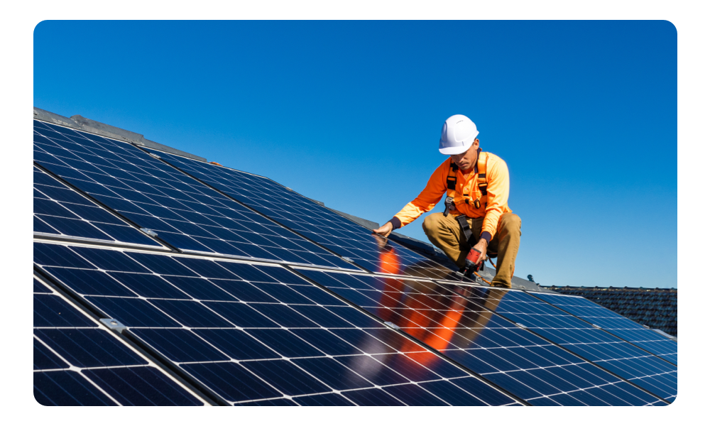 A technician fixing solar panels