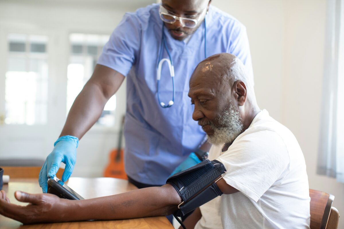 A general practitioner in Australia providing care supported by operations that maximise his availability for patients